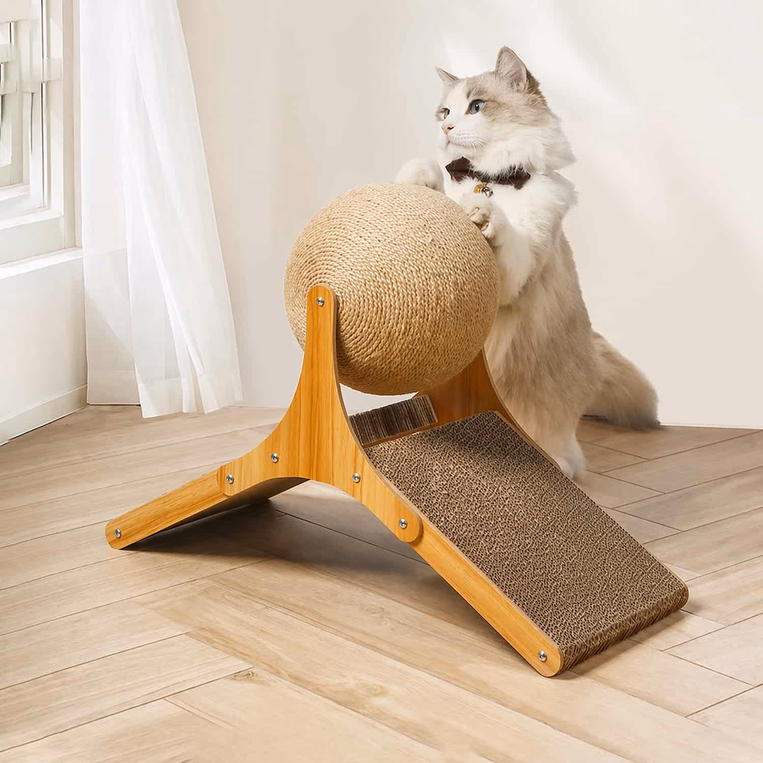 Cat scratcher with spinning sisal rope ball mounted on solid wood frame with corrugated cardboard ramp