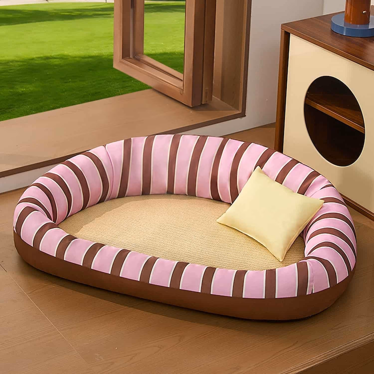 Oval cat cooling bed with natural rattan mat center and raised bolster edges