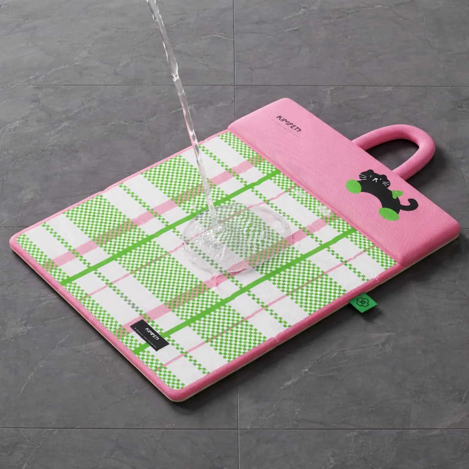 Pink double sided pet mat with plaid pattern, built in pillow, carry handle, and zoned spine support shown with a small white dog