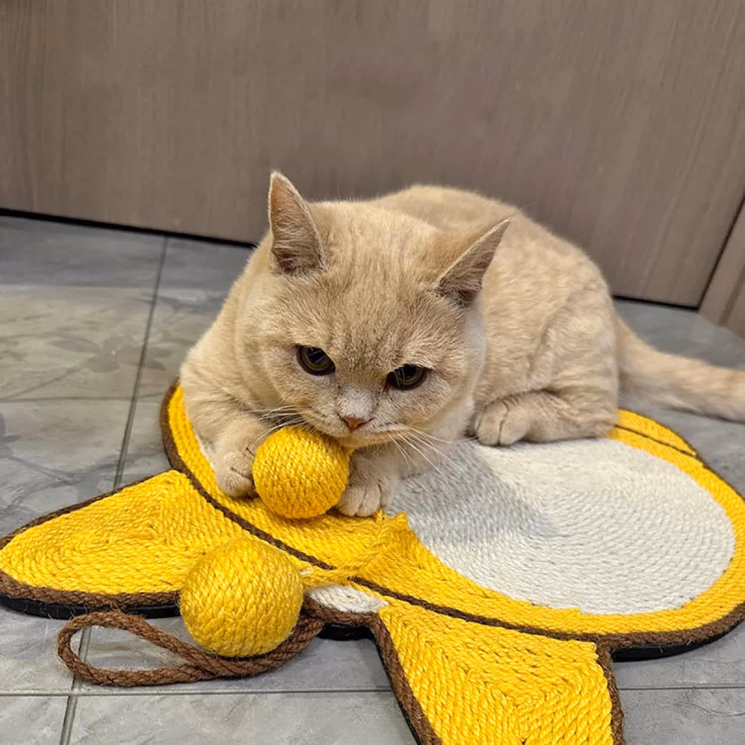 Round sisal cat scratcher pad with thick non-slip EVA base and included adhesive wall hooks